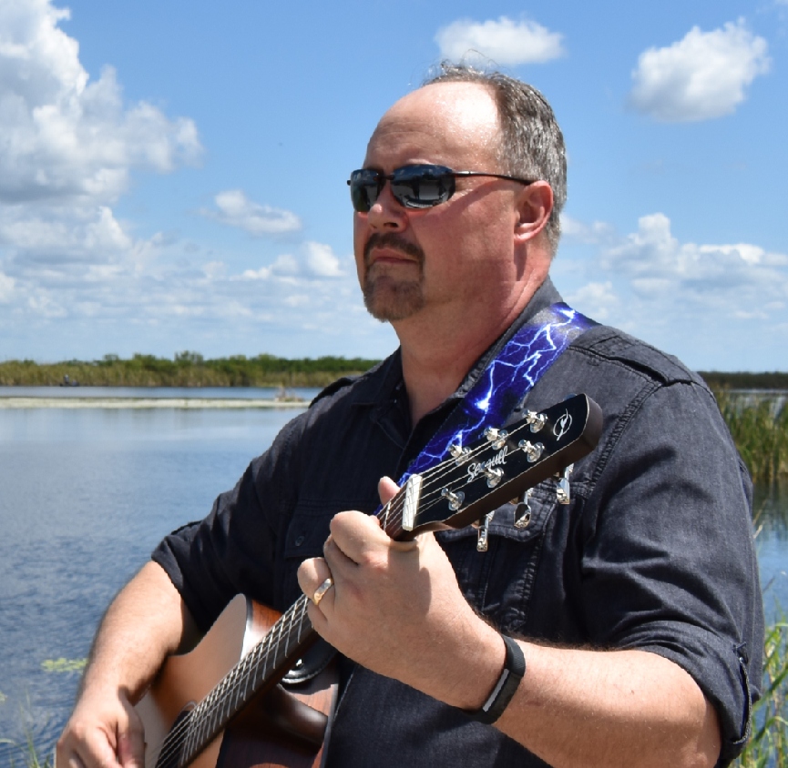 Jim Ezzell playing guitar
